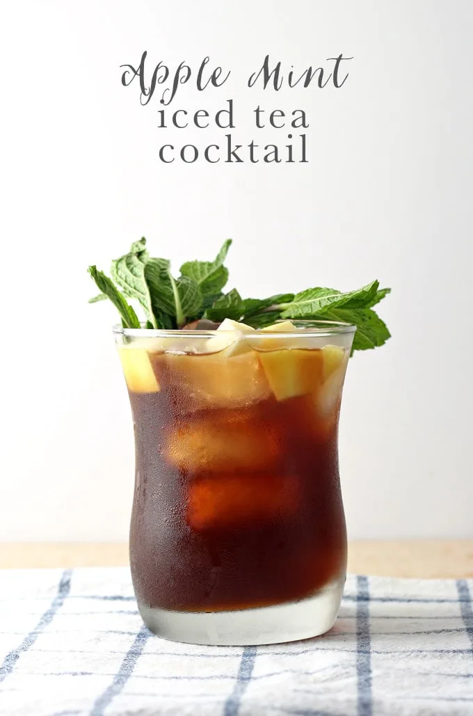 This apple mint iced tea cocktail is delicious, refreshing and perfect for the summer! Make one today to celebrate National Iced Tea Month. | honeyandbirch.com