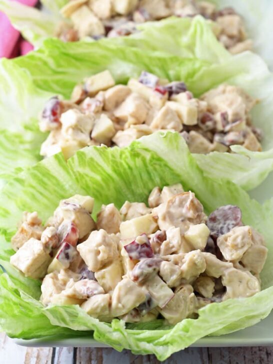 These grilled chicken salad lettuce wraps are a healthy addition to your lunch. Nuts, grapes, apples and chicken are joined by a honey balsamic vinaigrette. | honeyandbirch.com