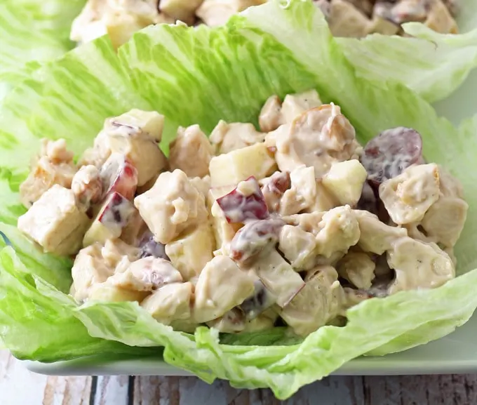 These grilled chicken salad lettuce wraps are a healthy addition to your lunch. Nuts, grapes, apples and chicken are joined by a honey balsamic vinaigrette. | honeyandbirch.com