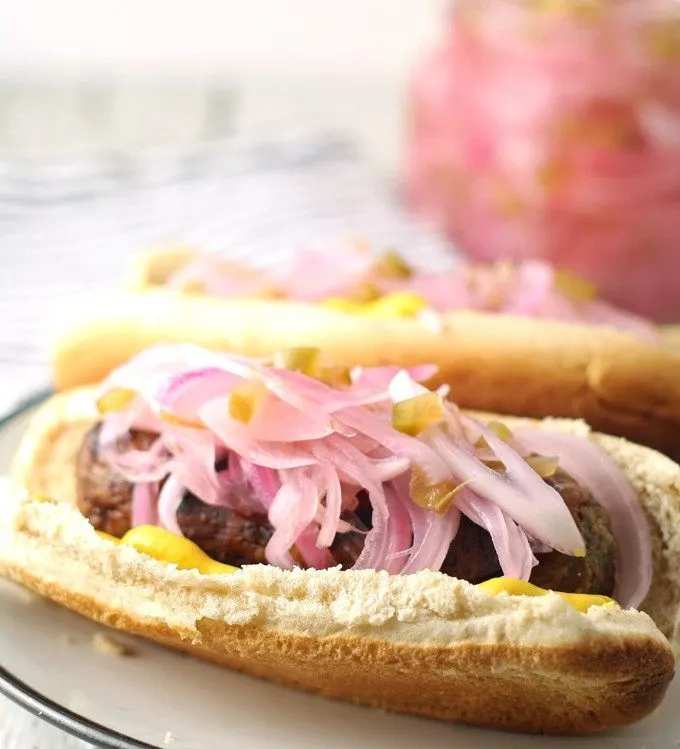 onion relish on a sausage in a bun