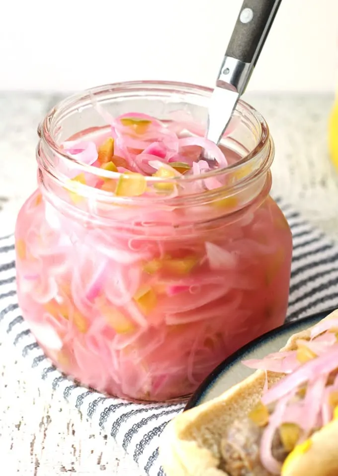 This onion relish recipe is perfect for summer barbecues! Put a jar of it next to the mustard and ketchup - your hot dogs and sausages will never be the same without it! | honeyandbirch.com