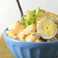 Try this easy potato egg salad! It is the perfect side dish for your next BBQ and all of the summer holidays: Memorial Day, 4th of July and Labor Day! | honeyandbirch.com