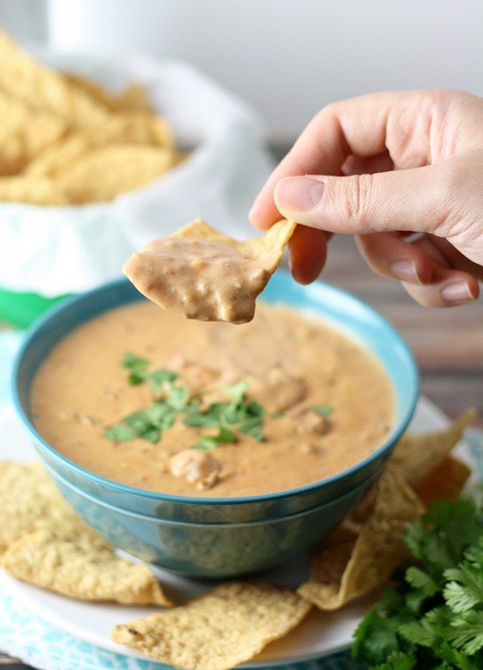 This slow cooker taco dip is perfect for parties - it can easily be thrown together in 2 hours with store bought ingredients! | honeyandbirch.com