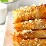 These baked buffalo chicken egg rolls are great as an appetizer or lunch! Pair them with blue cheese dressing and extra buffalo sauce! If you're looking for game day recipes, this is the perfect appetizer! | honeyandbirch.com