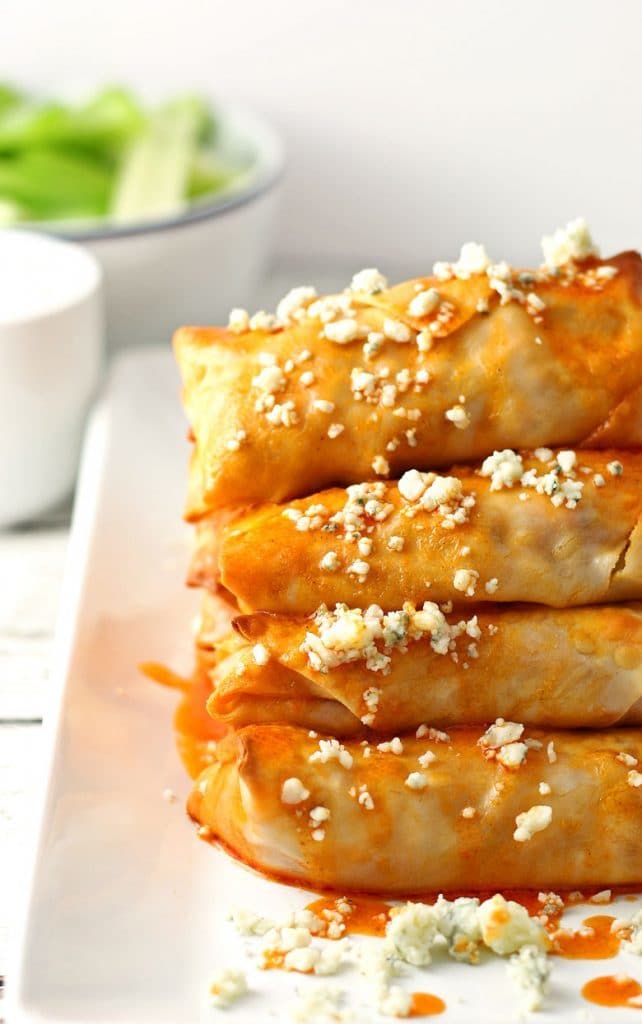 pile of baked buffalo chicken egg rolls