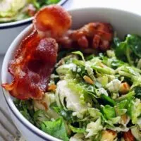 This Brussels sprouts kale salad with bacon, almonds, blue cheese and a lemon garlic vinaigrette is perfect for lunch or a light dinner!