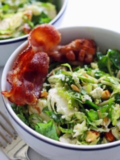 This Brussels sprouts kale salad with bacon, almonds, blue cheese and a lemon garlic vinaigrette is perfect for lunch or a light dinner!