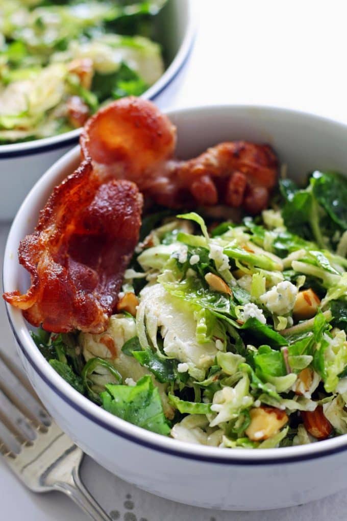 Brussels sprouts kale salad in a white bowl