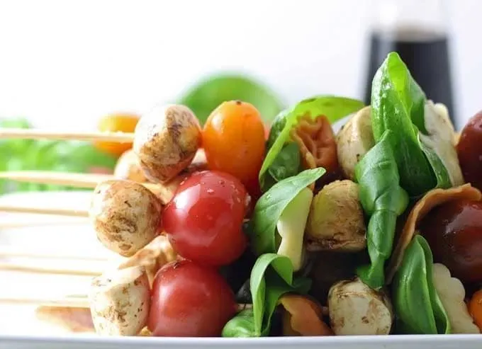 Caprese Tortellini Skewers are a fun appetizer on a stick! Perfect for parties and barbecues. | honeyandbirch.com