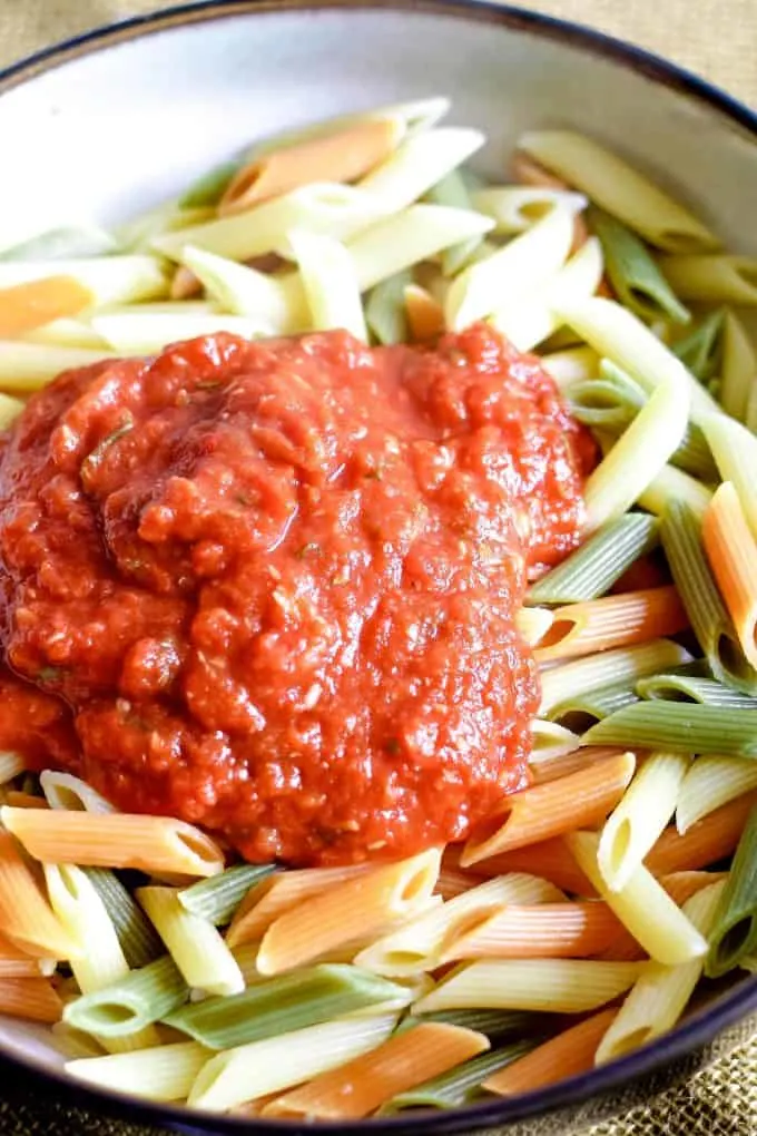 basil roasted garlic pasta sauce on a bed of pasta