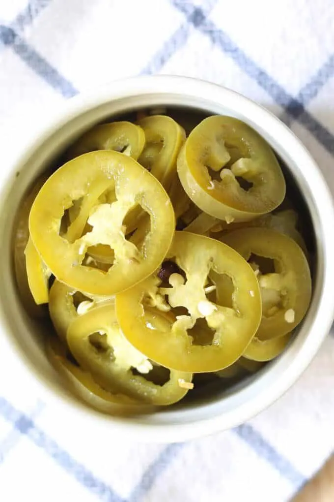 closeup photo of pickled jalapeños 