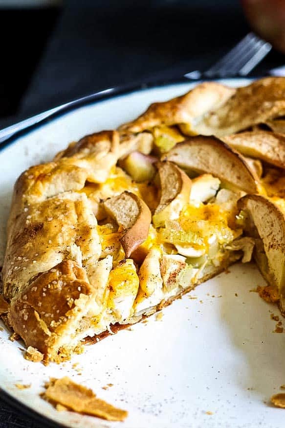 savory apple galette with a triangular piece removed