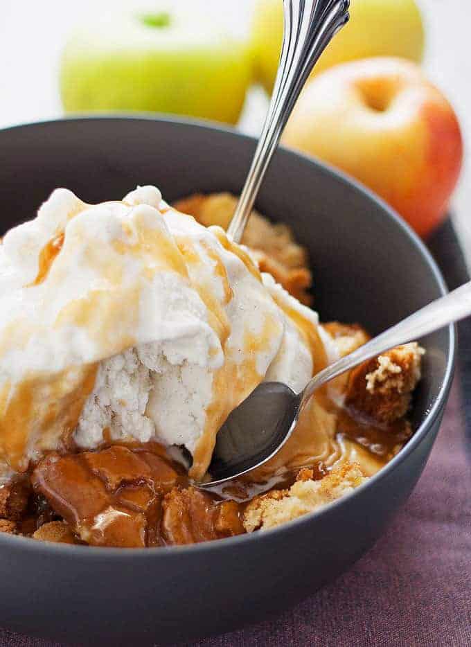 This apple cake sundae is a fun and easy fall dessert. Hot apple cake is topped with creamy vanilla ice cream and drizzles of caramel!