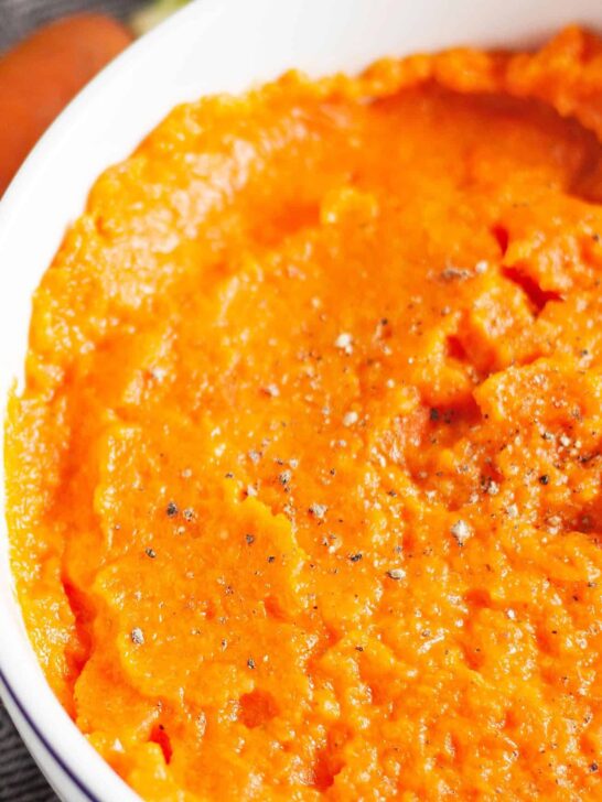 ginger mashed carrot side dish in a white bowl