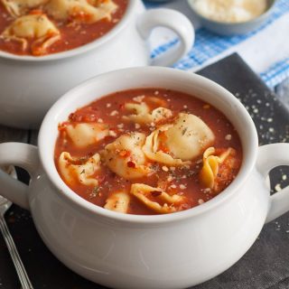 3 Ingredient Tomato Tortellini Soup - if you're short on time, make this soup! It only takes 15 minutes from start to finish and is full of flavor. Plus, 3 variations are included with easy additions for more soup deliciousness! | honeyandbirch.com