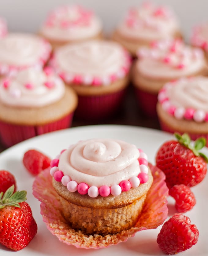 Double Berry Cupcakes - both the cupcakes and frosting are made with a mixture of raspberry and strawberry puree! | honeyandbirch.com