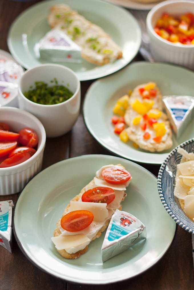 Try these homemade red pepper flatbread crackers with Laughing Cow cheese and some of these easy toppings to reinvent snacking! | honeyandbirch.com
