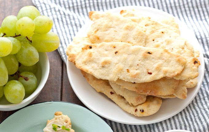 Try these homemade red pepper flatbread crackers with Laughing Cow cheese and some of these easy toppings to reinvent snacking! | honeyandbirch.com