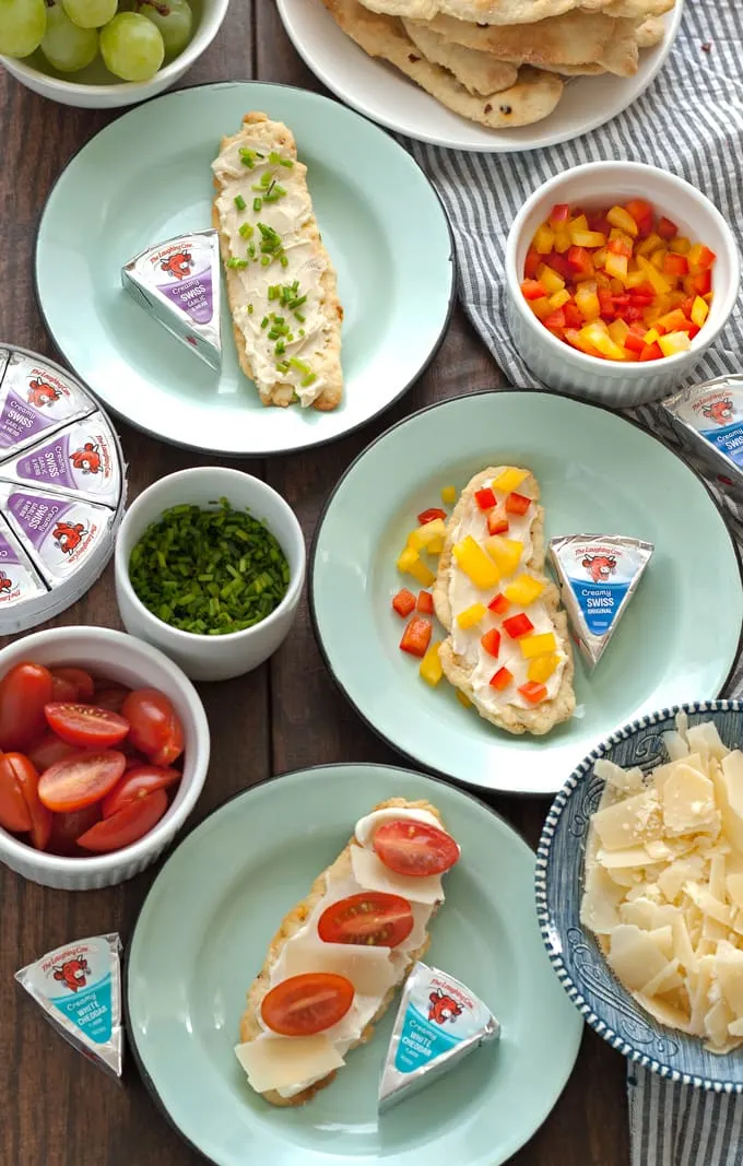 Try these homemade red pepper flatbread crackers with Laughing Cow cheese and some of these easy toppings to reinvent snacking! | honeyandbirch.com