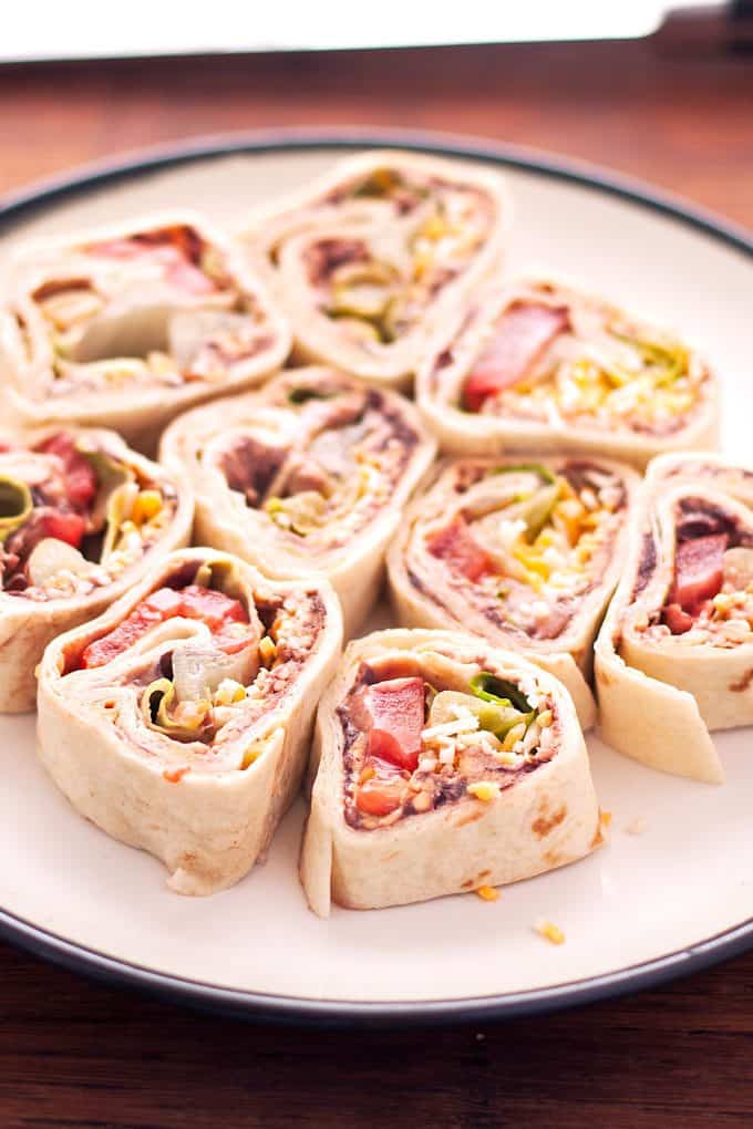 white plate filled with taco pinwheels
