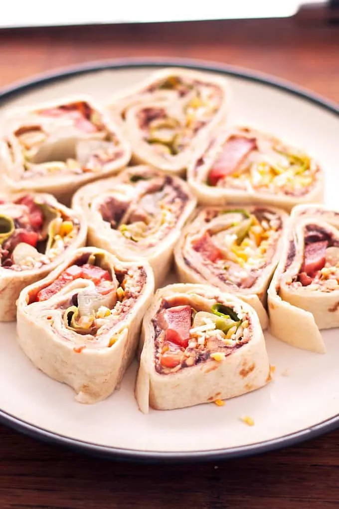 white plate filled with taco pinwheels