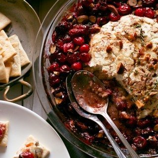 This fancy baked goat cheese roasted cranberry appetizer recipe is easier to make than it looks! It is the perfect appetizer for holiday gatherings like Thanksgiving and Christmas! | honeyandbirch.com