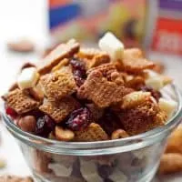 Try this cinnamon snack mix recipe - full of rice cereal, pretzels, graham crackers, cranberries and white chocolate! | honeyandbirch.com