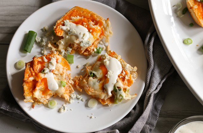 This buffalo chicken pizza bread recipe is going to be a hit at your next party! It's made with KING’S HAWAIIAN® Sweet Bread Rolls for easy eating and is the perfect appetizer or lunch! | honeyandbirch.com