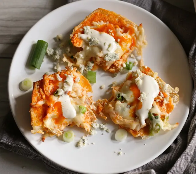 This buffalo chicken pizza bread recipe is going to be a hit at your next party! It's made with KING’S HAWAIIAN® Sweet Bread Rolls for easy eating and is the perfect appetizer or lunch! | honeyandbirch.com