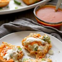 This buffalo chicken pizza bread recipe is going to be a hit at your next party! It's made with KING’S HAWAIIAN® Sweet Bread Rolls for easy eating and is the perfect appetizer or lunch! | honeyandbirch.com