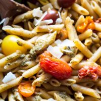 pan filled with tomato and pesto pasta