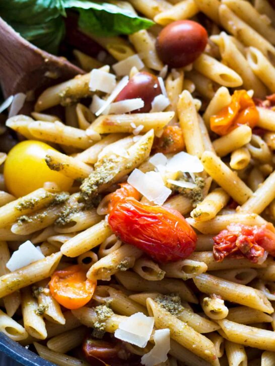 pan filled with tomato and pesto pasta