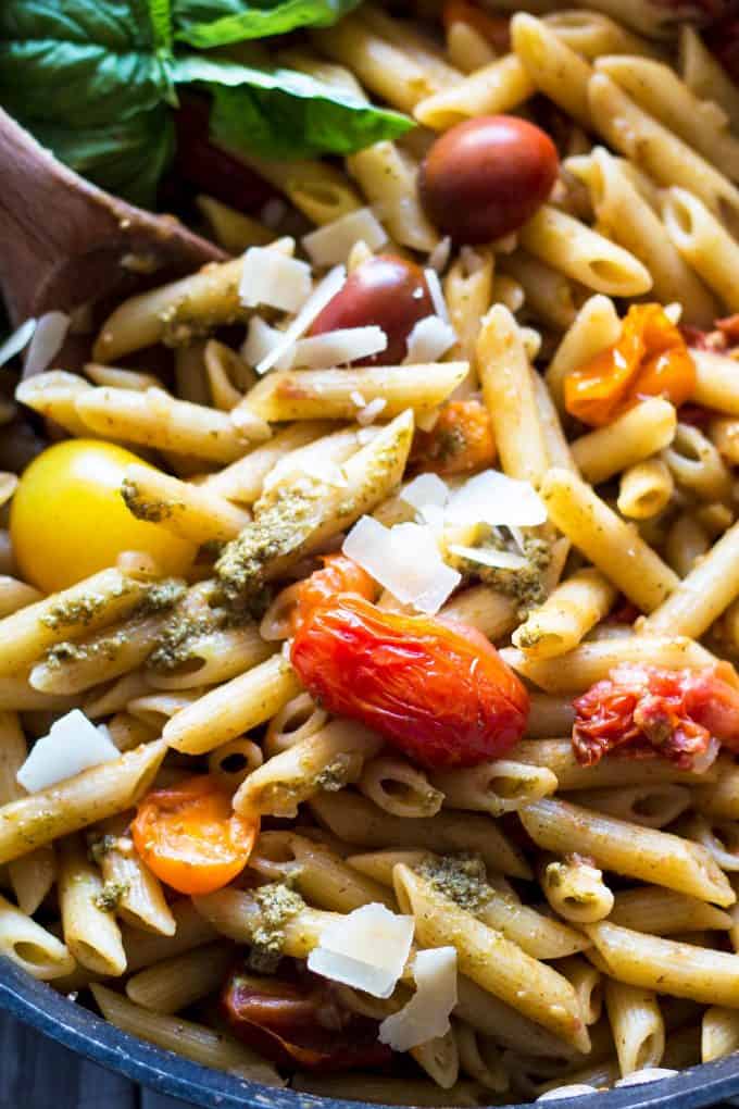 pan filled with tomato and pesto pasta