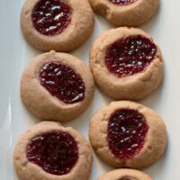 Raspberry chocolate shortbread thumbprint cookies - only 6 ingredients! These cookies are so easy to make and are my new Favorite! | honeyandbirch.com