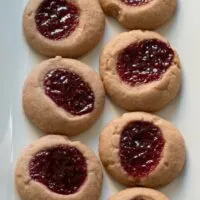 Raspberry chocolate shortbread thumbprint cookies - only 6 ingredients! These cookies are so easy to make and are my new Favorite! | honeyandbirch.com