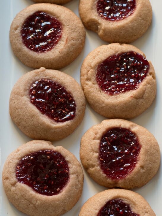 Raspberry chocolate shortbread thumbprint cookies - only 6 ingredients! These cookies are so easy to make and are my new Favorite! | honeyandbirch.com