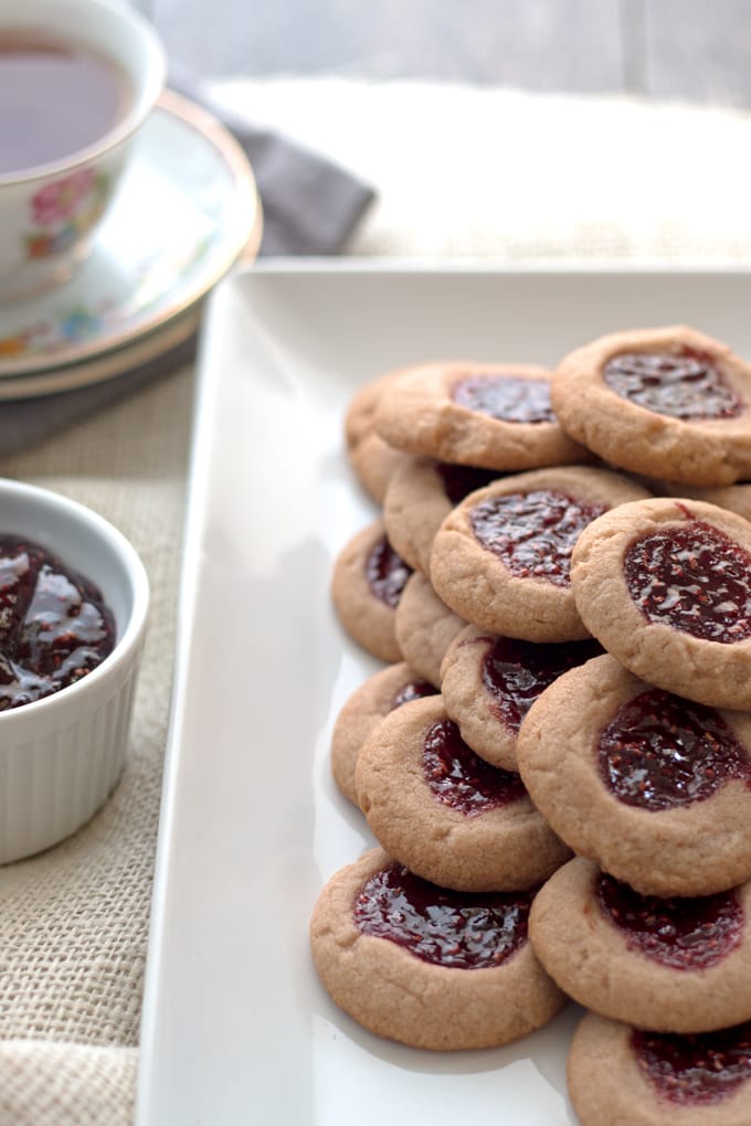 Raspberry chocolate shortbread thumbprint cookies - only 6 ingredients! These cookies are so easy to make and are my new Favorite! | honeyandbirch.com