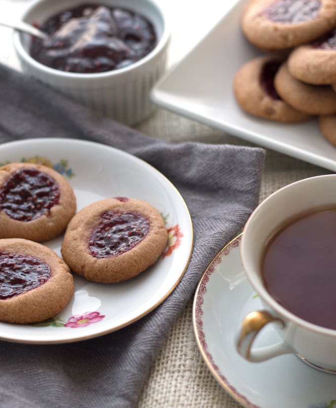 Raspberry chocolate shortbread thumbprint cookies - only 6 ingredients! These cookies are so easy to make and are my new Favorite! | honeyandbirch.com