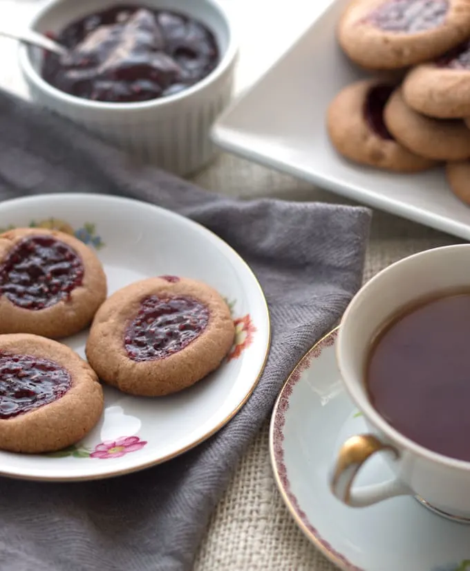 Raspberry chocolate shortbread thumbprint cookies - only 6 ingredients! These cookies are so easy to make and are my new Favorite! | honeyandbirch.com