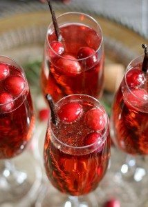 This vanilla cranberry mimosa cocktail is perfect for winter brunches, Christmas, and holiday and New Year's Eve parties! This drink recipe only requires 3 ingredients and is very easy to make. | honeyandbirch.com