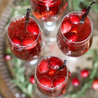 This vanilla cranberry mimosa cocktail is perfect for winter brunches, Christmas, and holiday and New Year's Eve parties! This drink recipe only requires 3 ingredients and is very easy to make. | honeyandbirch.com