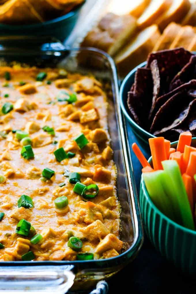 buffalo chicken dip with carrots, chips, and bread