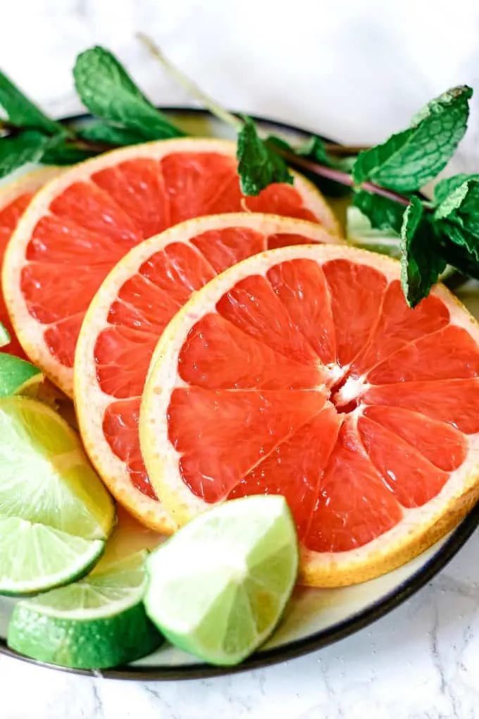 sliced grapefruit and limes