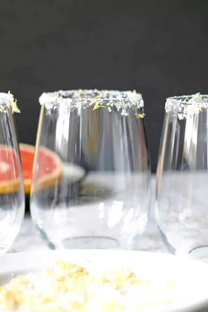 3 glasses rimmed in citrus margarita salt