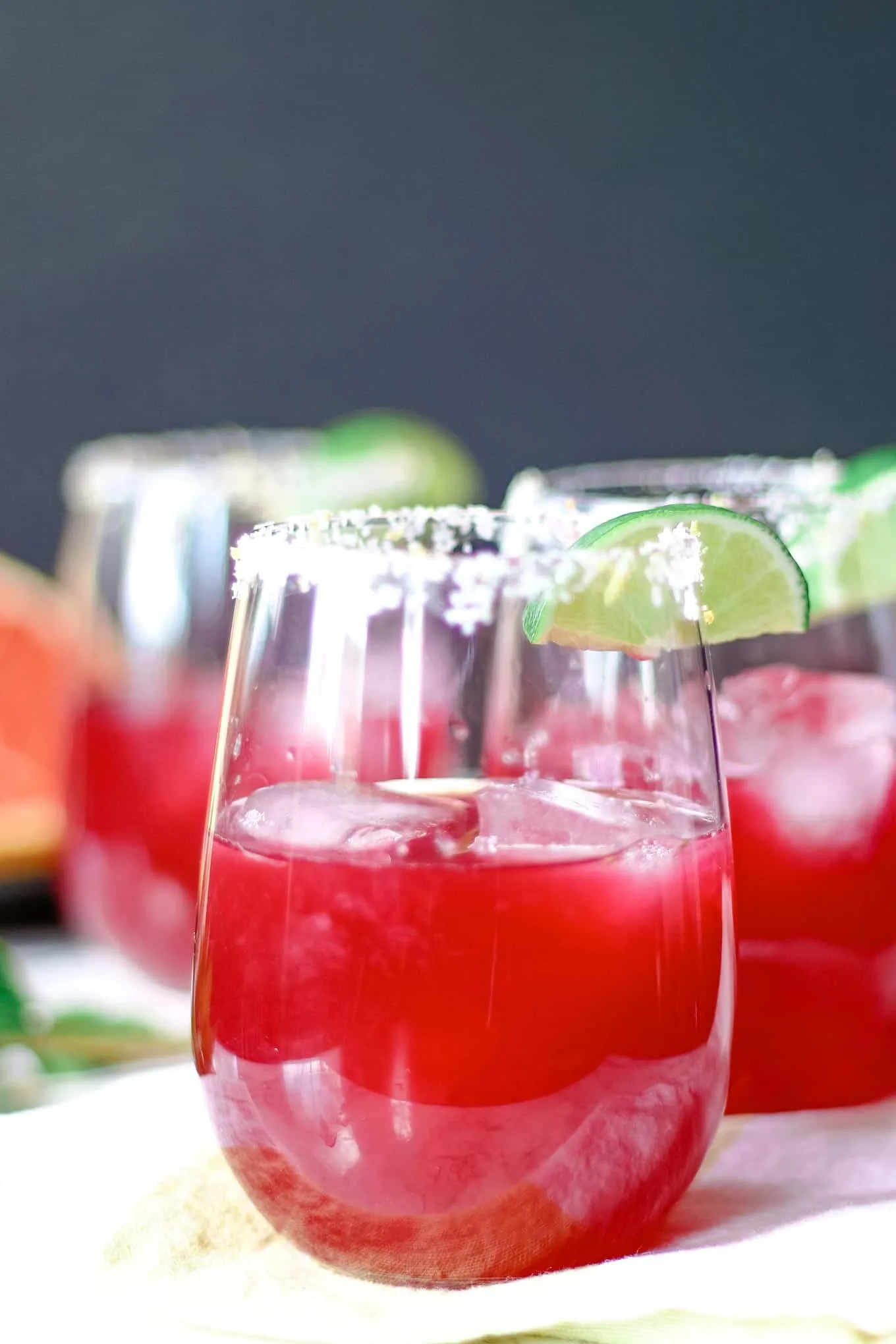 three grapefruit hibiscus margaritas