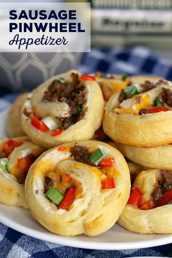 If you're looking for game day food, this sausage pinwheel appetizer is going to be your new favorite recipe for tailgating season. It's made with sausage, refrigerated crescent rolls, red bell peppers and two types of cheese;it's an easy and delicious appetizer to add to your party. Just serve it with a little ranch! | honeyandbirch.com