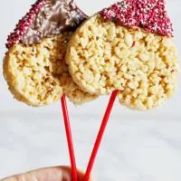 2 heart shaped Rice Krispie pops with sprinkles