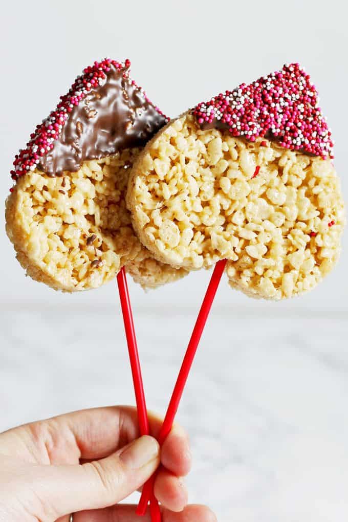 2 heart shaped Rice Krispie pops with sprinkles