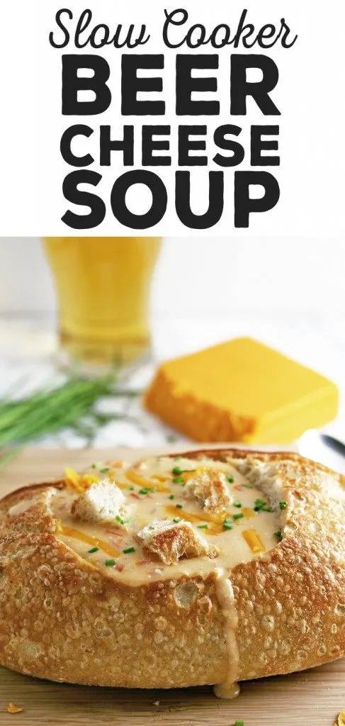This slow cooker beer cheese soup is super easy to make! It combines sharp cheddar cheese, cream cheese and beer and is delicious for lunch or dinner. Serve it with crusty bread or like me, in a sour dough bread bowl! | honeyandbirch.com