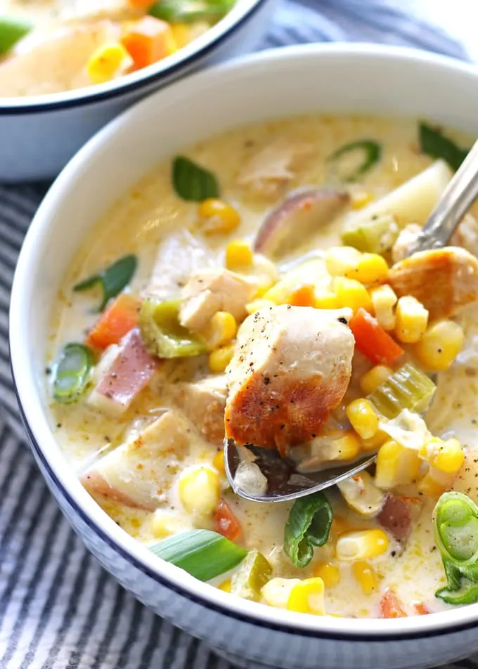 This chicken corn chowder recipe is creamy and hearty comfort food. The recipe is easy to follow and full of veggies! | honeyandbirch.com